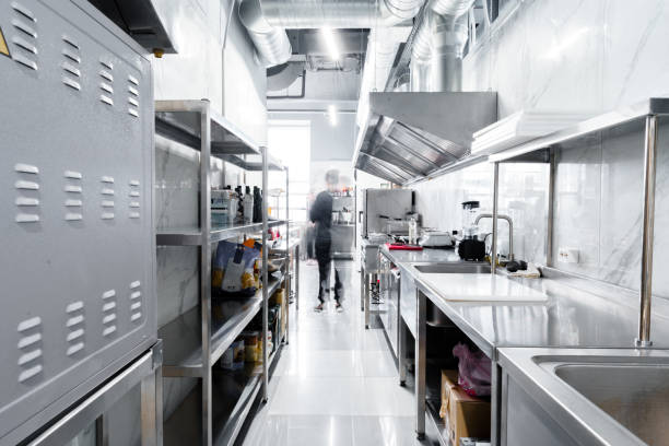 Chef organizing eating place components in a business kitchen